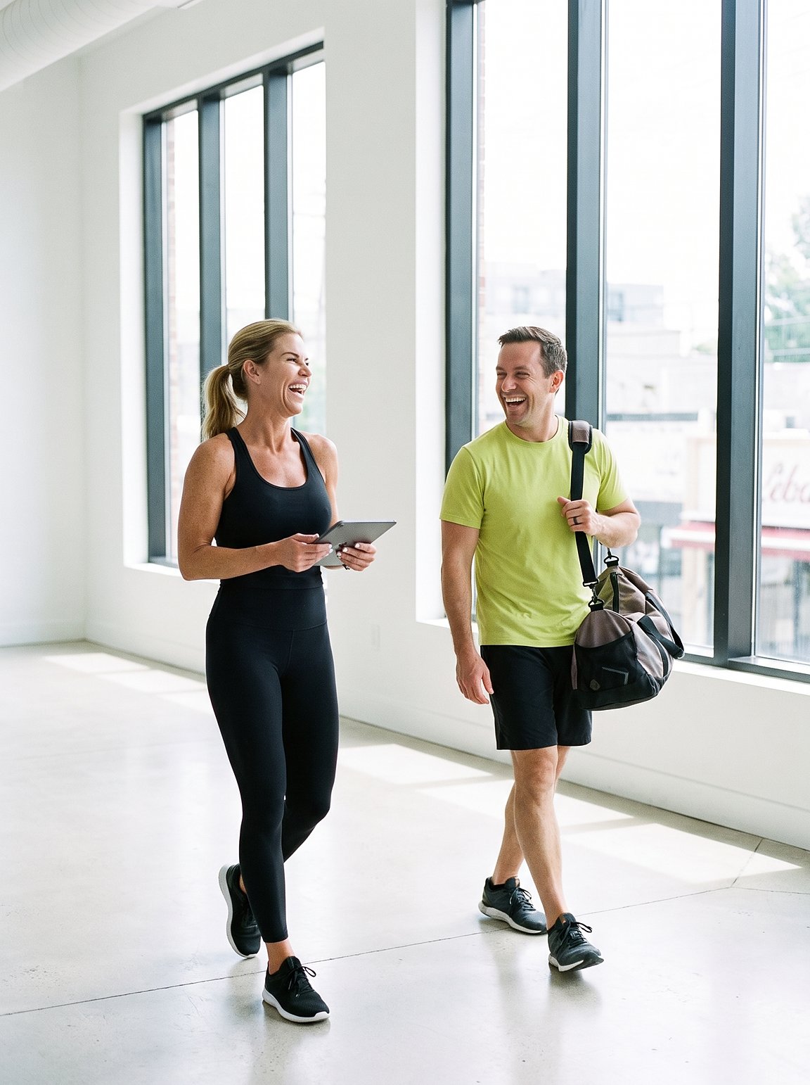 Fiona Rooney walking the gym floor with a client