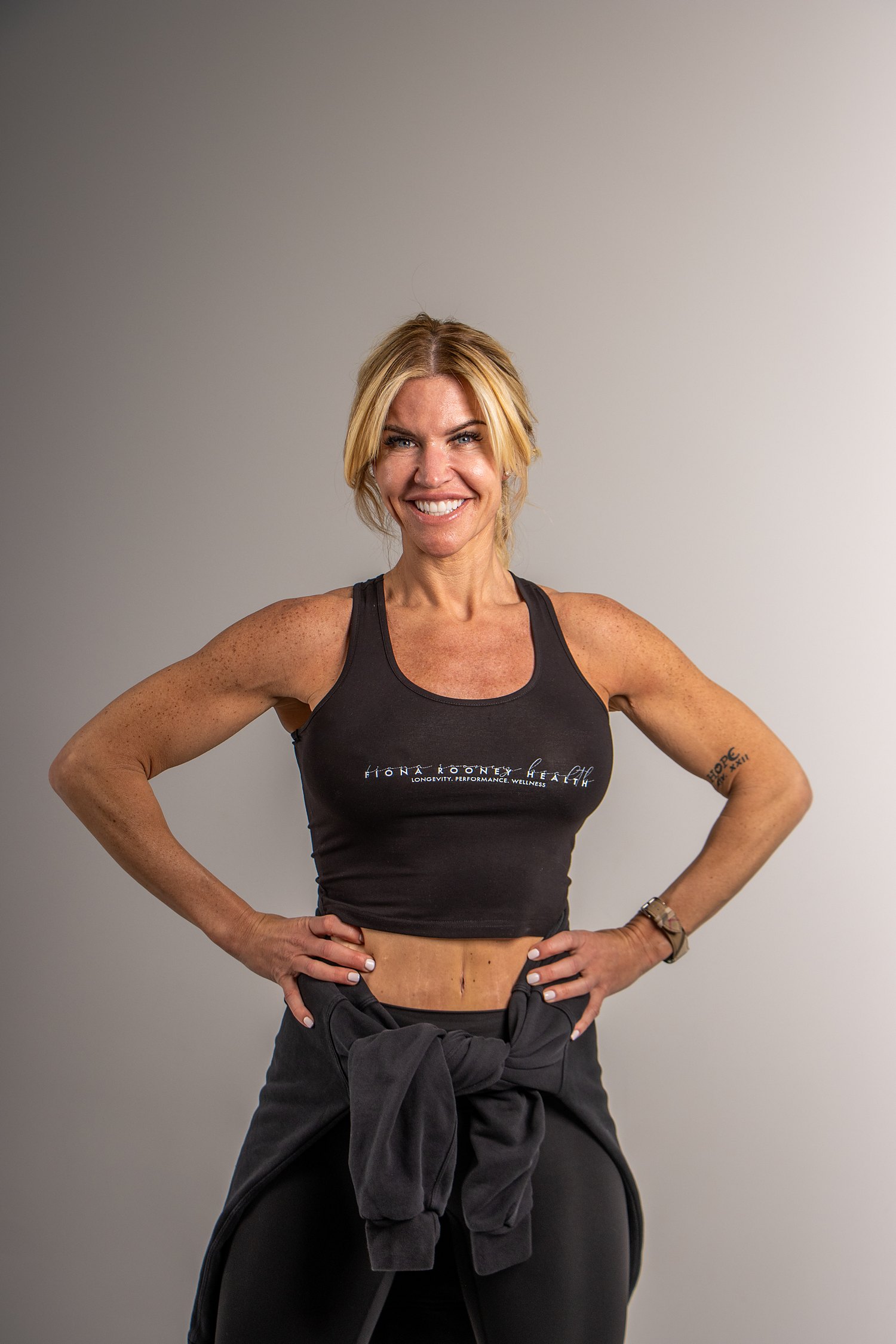 Fiona Rooney, studio portrait in Fiona Rooney Health training wear
